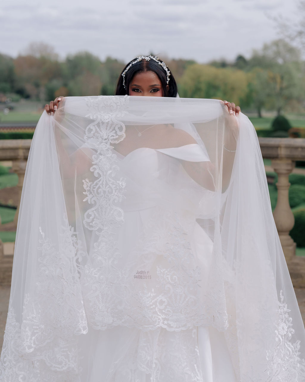 Bride holding bridal veil